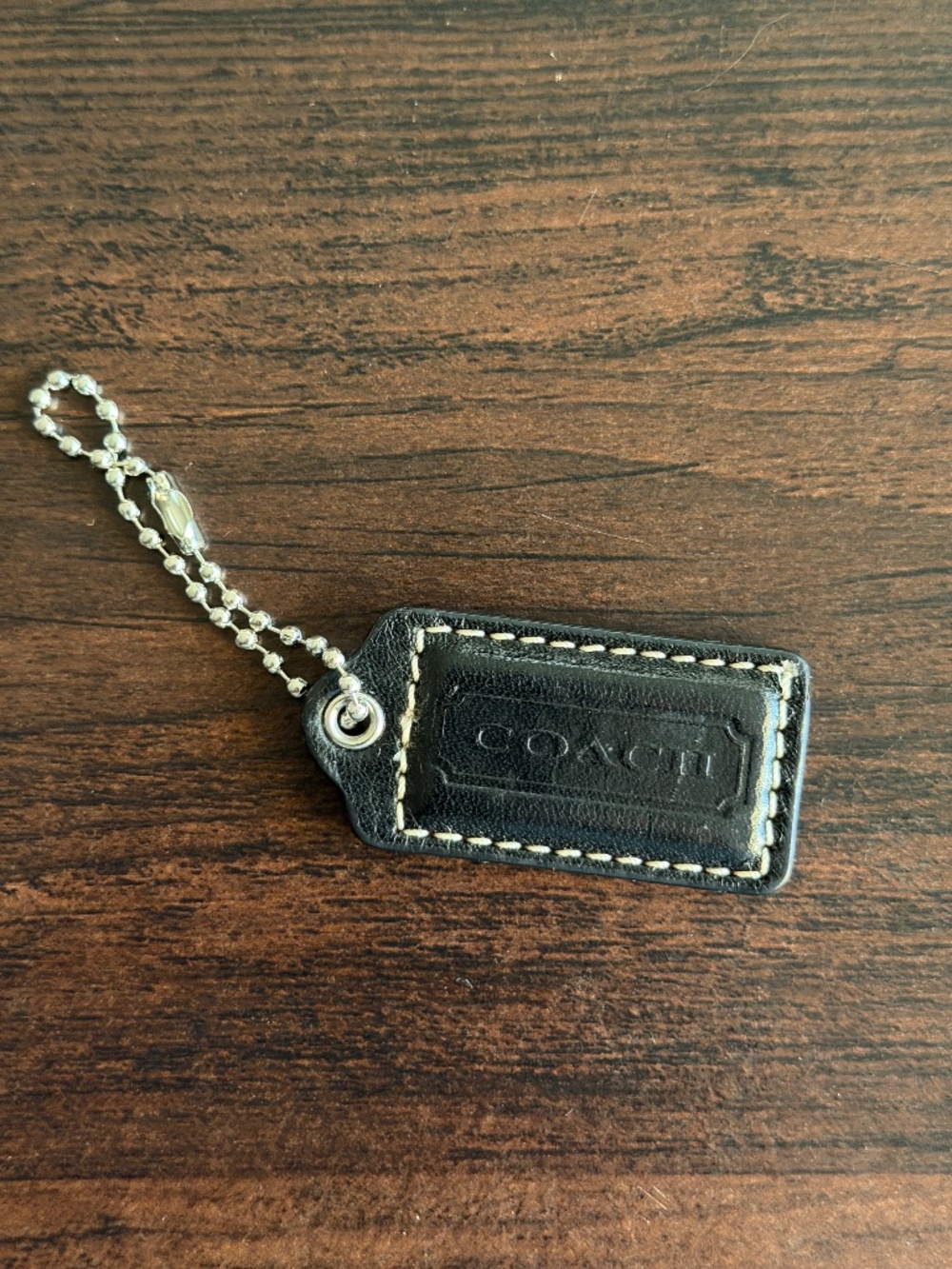 Coach black leather hangtag